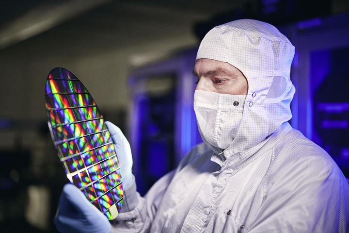 Cleanroom employee with wafer