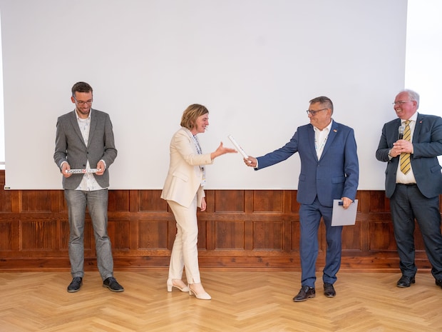 Symbolical change of the directorship handing over of symbolical baton between competition directors